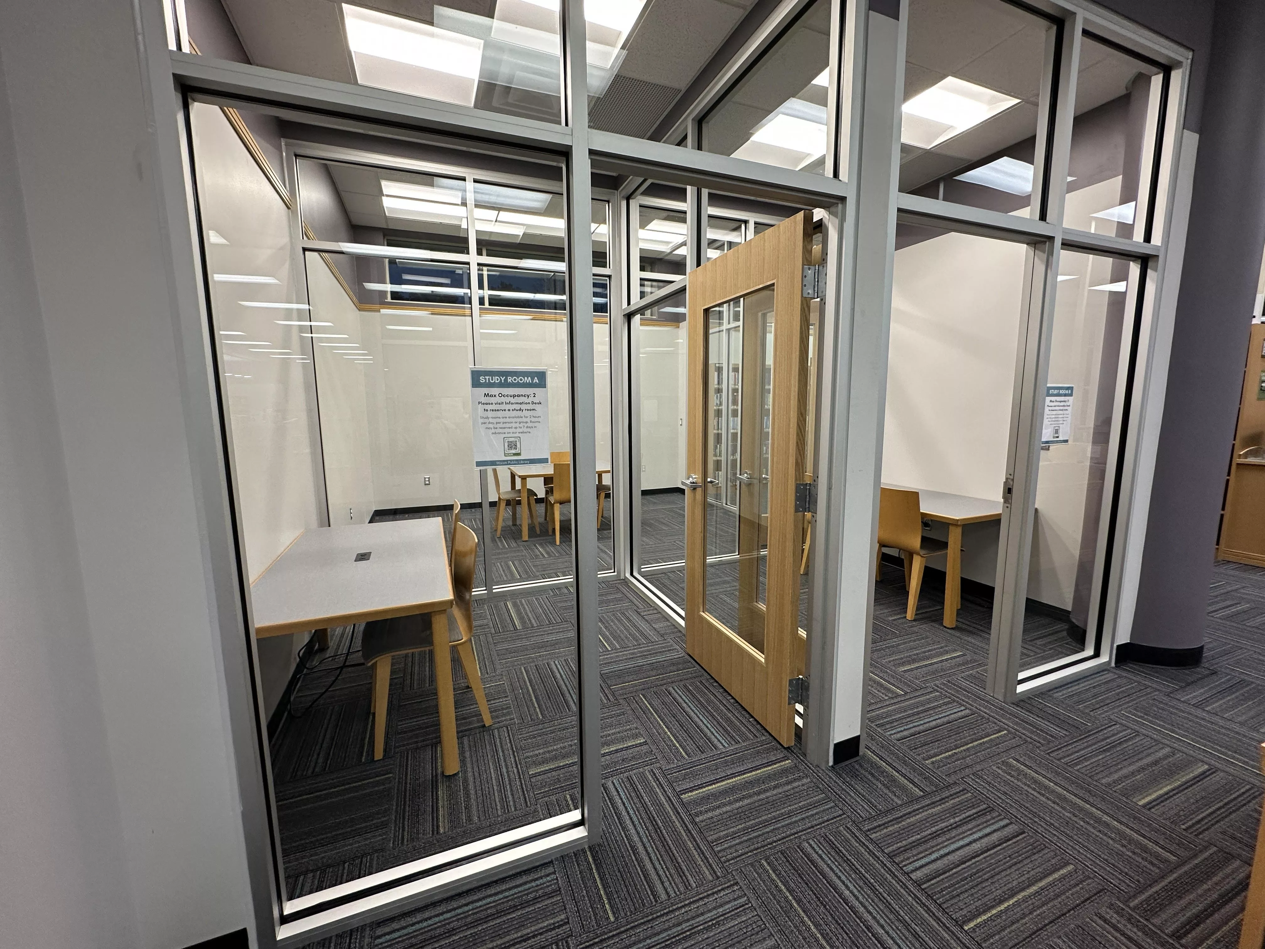 Two study rooms each with a table and two chairs.