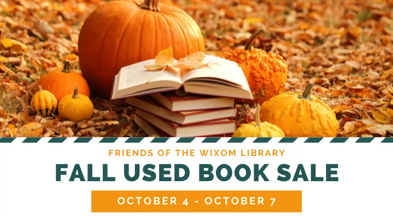 Friends Fall used book sale October 4-7. Photo of stack of open books on top of autumn leaves.