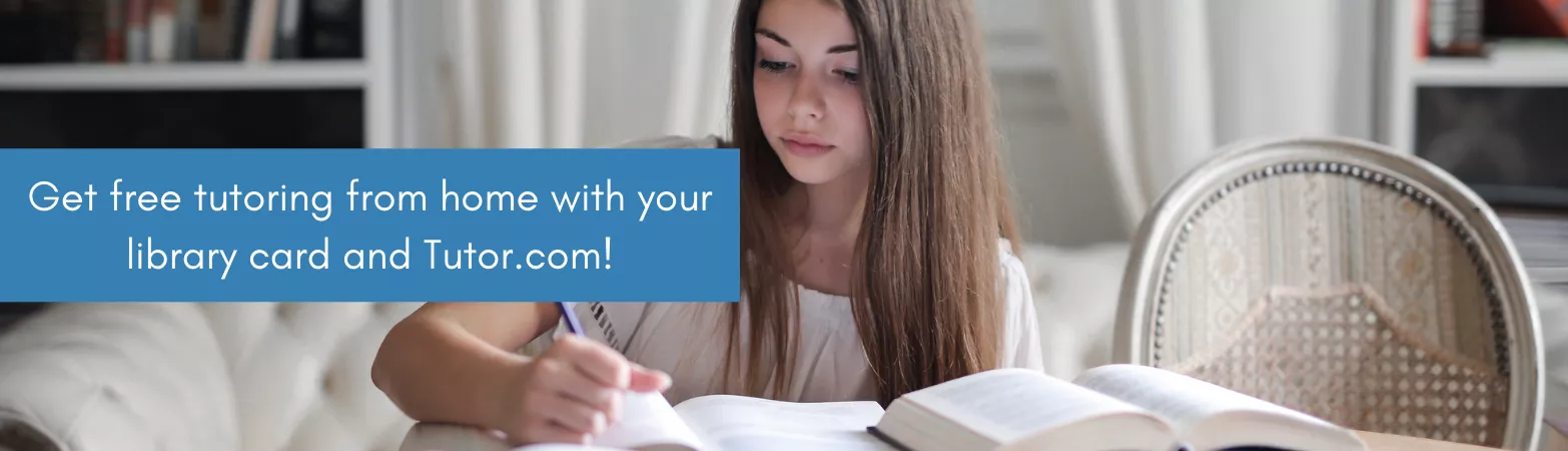 teen girl with brown hair studying with open books at a table